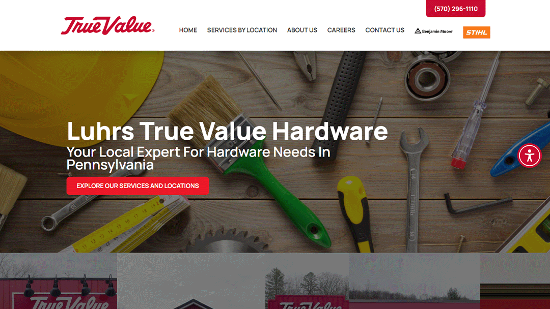 Homepage of Luhrs True Value Hardware featuring various tools and a yellow hard hat on a wooden surface background. Text in the center reads 'Luhrs True Value Hardware - Your Local Expert For Hardware Needs In Pennsylvania.' Below the text is a red button that says 'Explore Our Services and Locations.' The top navigation bar includes links for Home, Services By Location, About Us, Careers, and Contact Us, along with logos for Benjamin Moore and STIHL.