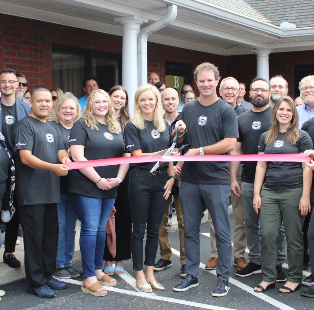 A composite image of a close-up hand using a smartphone and a couple sitting on a couch looking at a laptop together, representing shared digital experiences and online interaction at home.