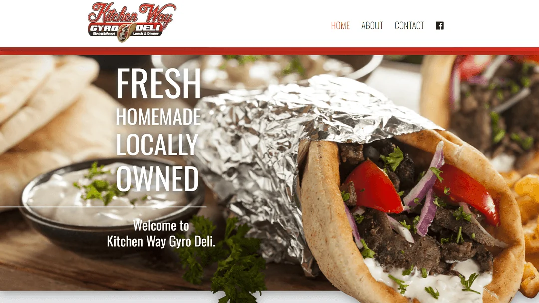 Close-up of a delicious gyro wrapped in foil with fresh tomatoes, onions, and tzatziki sauce. The Kitchen Way Gyro Deli logo is visible along with navigation links. Text overlay reads 