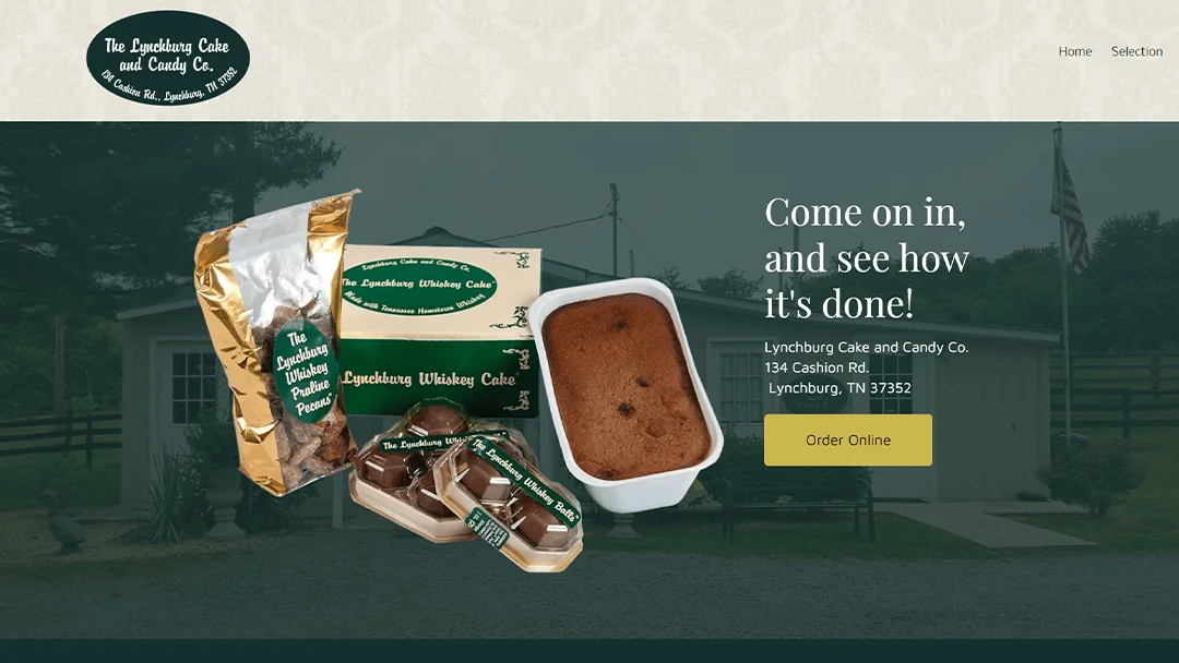 Assortment of Lynchburg Cake and Candy Co. products, including whiskey cake and praline pecans, displayed in front of a rustic building. The company logo is visible along with navigation links. Text overlay reads 