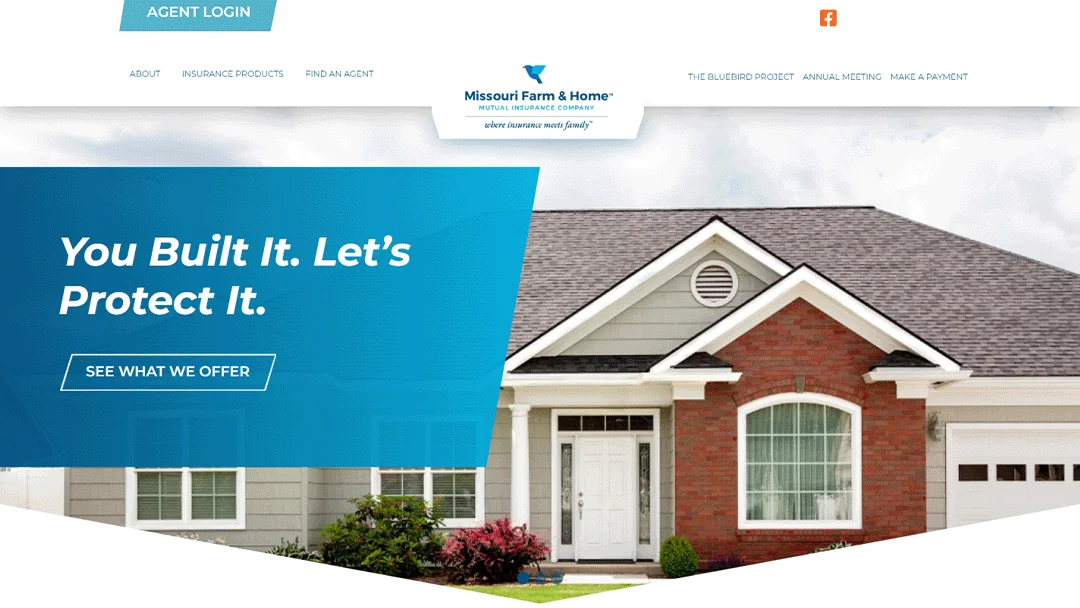 Homepage banner of Missouri Farm & Home Mutual Insurance Company featuring a modern suburban house with a blue overlay displaying the text 'You Built It. Let's Protect It.' A 'See What We Offer' button is visible. The top navigation includes About, Insurance Products, Find an Agent, The Bluebird Project, Annual Meeting, and Make a Payment. The company logo and tagline 'where insurance meets family' are displayed at the top center.