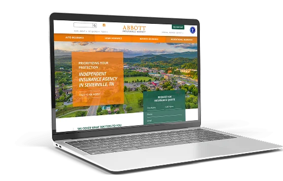 Laptop displaying the homepage of Abbott Insurance Agency, featuring an aerial view of Sevierville, TN with a bold message about independent insurance services.