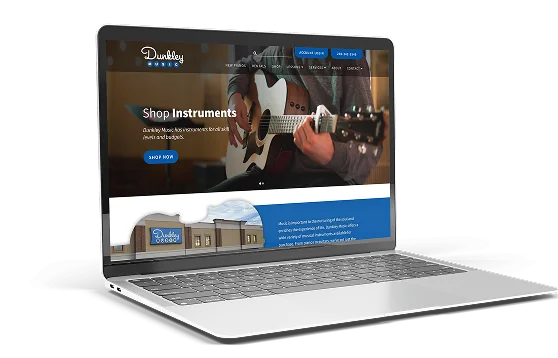 Laptop displaying the homepage of Dunlop Sound, a music store website featuring a person playing an acoustic guitar with a 'Shop Instruments' call-to-action.